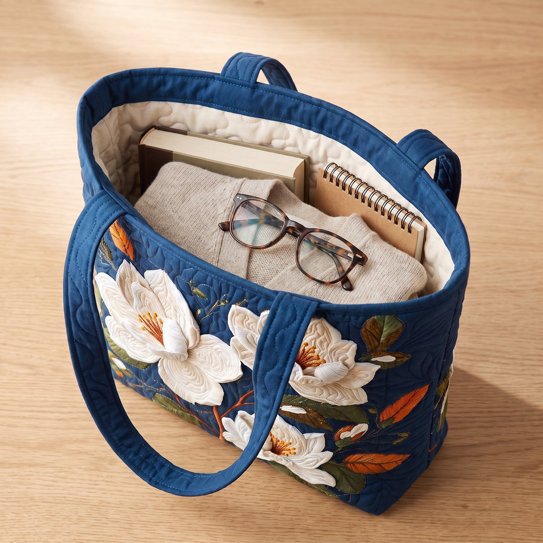 Artisan Quilted Bag - Delicate Magnolia — packed with a hardback book, a folded cardigan and reading glasses
