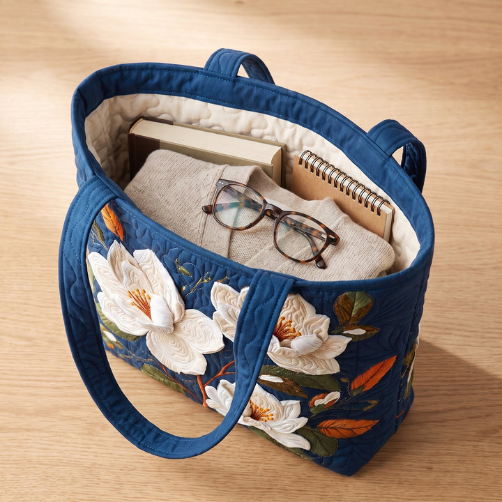 Artisan Quilted Bag - Delicate Magnolia — packed with a hardback book, a folded cardigan and reading glasses